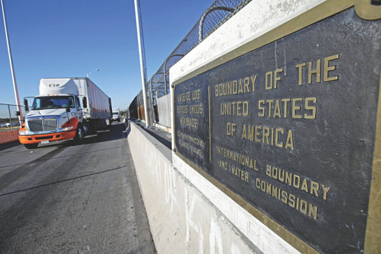 Trucks wait in the queue for border customs control to cross into US at the Bridge of Americas in Mexico