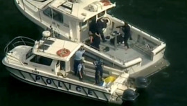 Police vessels are seen