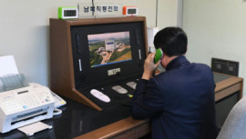 A South Korean government official checks the direct communications hotline