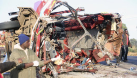 The wreckage of a bus and a truck
