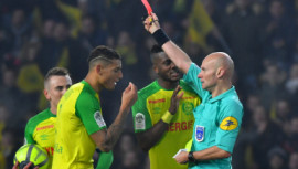 Diego Carlos and referee Tony Chapron