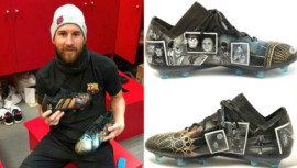 Lionel Messi with his new boots