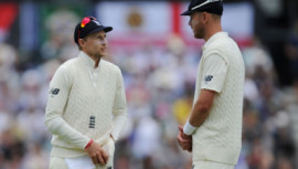 Joe Root with bowler Stuart Broad