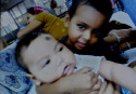 Baby falls off mother’s lap during mugging, dies