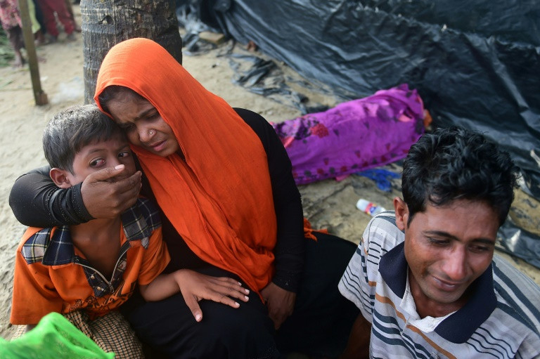 As Rakhine state burns and Rohingya flee, Aung San Suu Kyi prepares to address Myanmar on the crisis for the first time -- a high wire act seeking to soothe global outrage without baiting an army that is again showing its teeth.