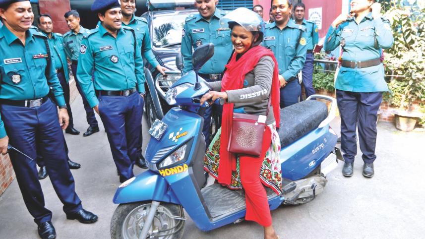 Shahanaj gets back bike.jpg