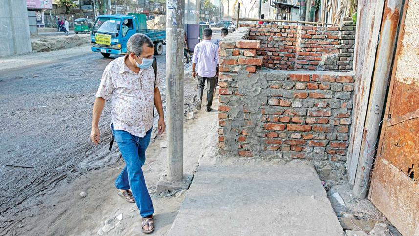 wall-built-on-drain.jpg