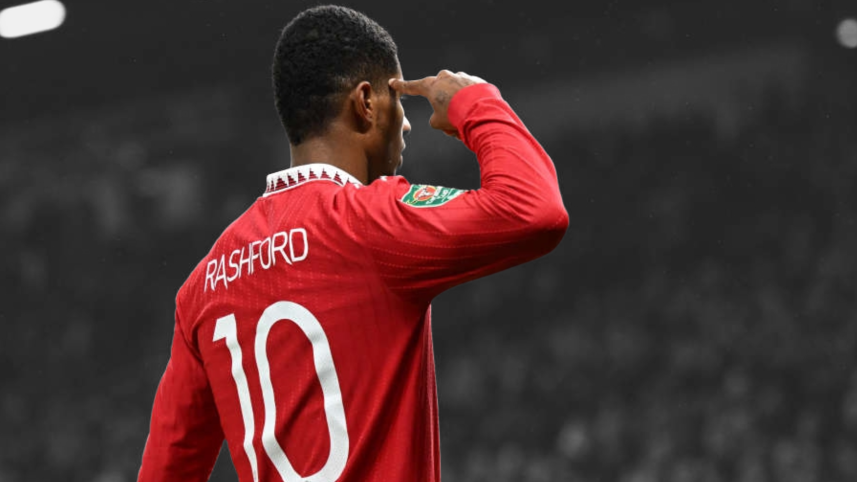 Marcus Rashford striking his iconic pose as a celebration after scoring a goal.