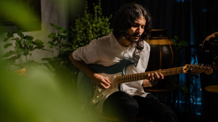 A person playing the guitar