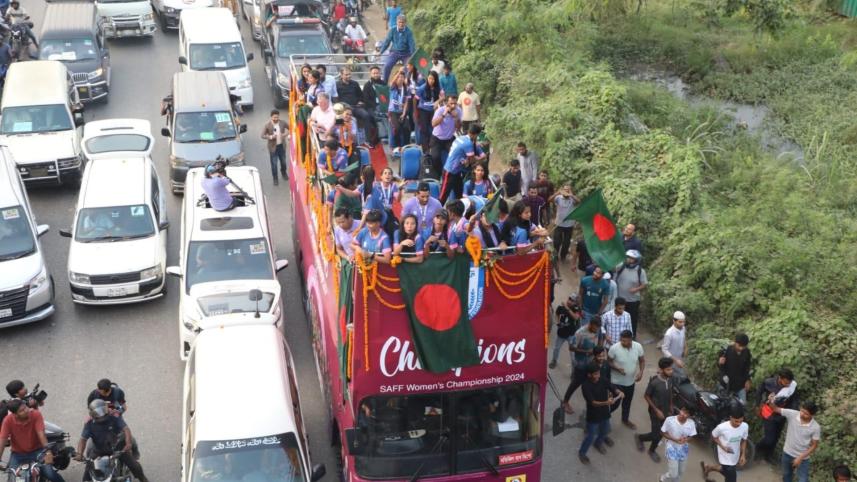 Bangladesh's triumphant SAFF winning team parade through the streets of Dhaka on an open-top bus.
