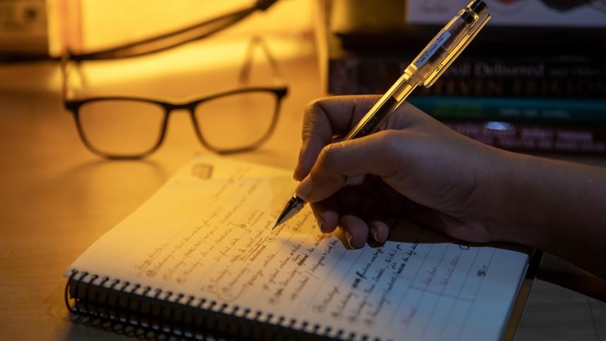 A person taking notes