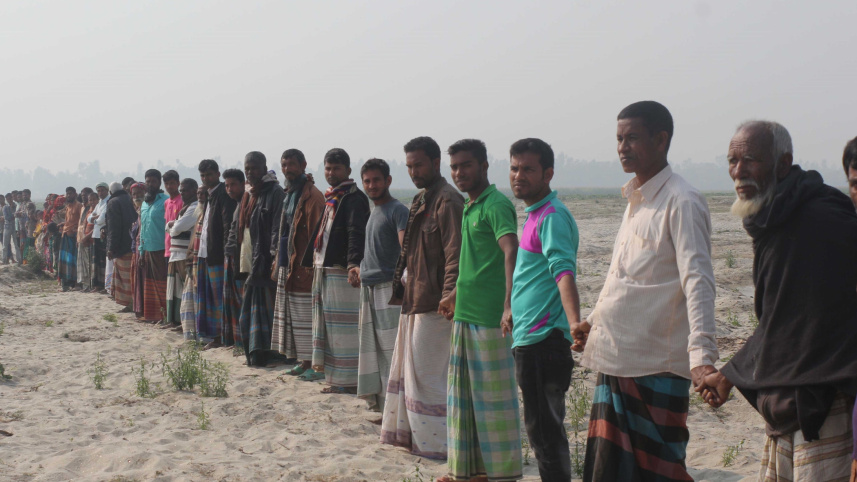 spare_dried_riverbed_human_chain.jpg