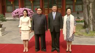 Kim visits China