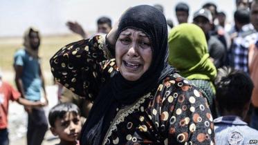 IS_Syria_civilians_flee_Tal_Abyad.jpg