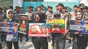 Suu-Kyi-side-migrants.jpg
