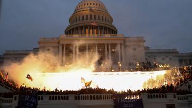 An explosion caused by a police munition is seen while supporters of President Donald Trump gather at the US Capitol Building in Washington, DC on January 6, 2021. File photo: Reuters