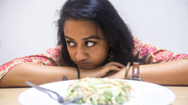 Girl in front of food