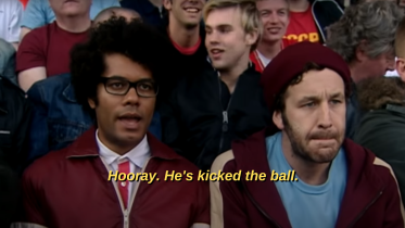Photo of Richard Ayoade as Moss saying "Hooray. He's kicked the ball."