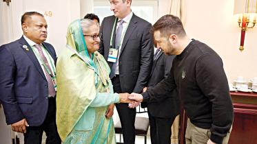 Ukraine’s President Volodymyr Zelenskiy greets Prime Minister Sheikh Hasina before their meeting at the Munich Security Conference yesterday.