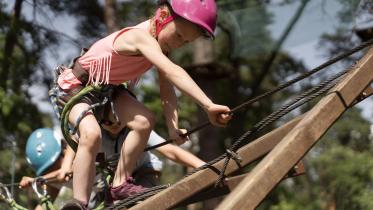brave-girl-having-fun-adventure-park.jpg