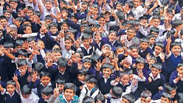 A crowd of school children celebrating