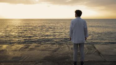 full-shot-contemplative-man-seaside.jpg
