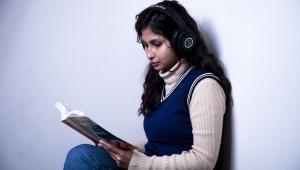 Girl listening to music while studying