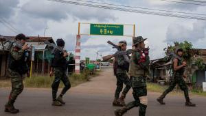 Volunteer members of Karenni insurgent forces walk in Moe Bye in Kayah State, Myanmar