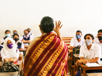 A teacher teaching her class.